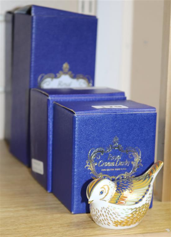 Four boxed Royal Crown Derby paperweights,